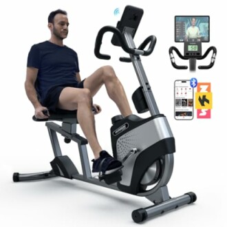 Man using a recumbent exercise bike with Bluetooth connectivity.