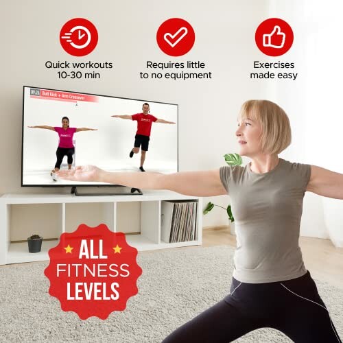 Woman doing a fitness routine in front of a TV with exercise prompts.