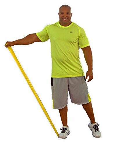 Man in athletic wear using a yellow resistance band