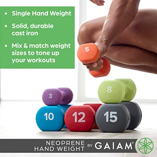 Person holding orange neoprene hand weight with various colored weights in the background.